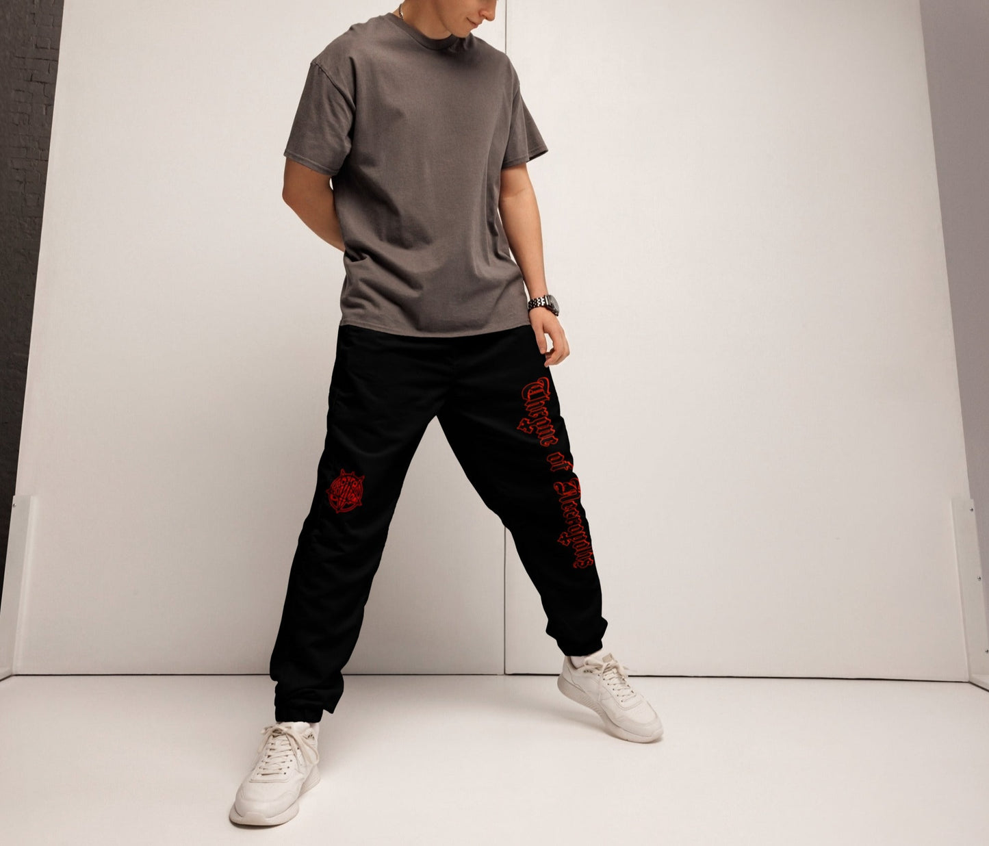 Model Wearing Black Joggers Pants Sweats Alternative Streetwear Red Throne of Necropolis logo Print and Seal Sigil Witch Occult Witchcraft Goetia Side view Angle